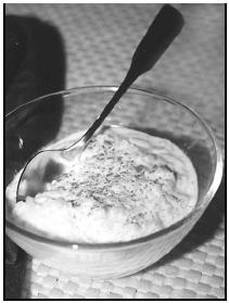 Arroz con Leche (rice pudding) may be served warm or chilled. A sprinkle of cinnamon adds just a hint of spice to complement the lemon peel in the pudding. EPD Photos