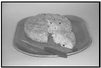 Irish Soda Bread, loaded with raisins and caraway seeds, is cut into wedges and served with sweet butter. EPD Photos