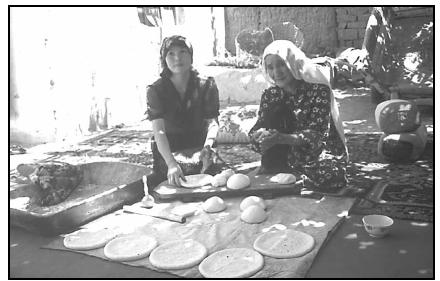 Nomadic women prepare bread to be baked on a griddle over an open fire. EPD Photos/Jeannine Davis-Kimball