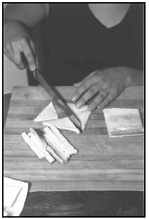 To use toast triangles instead of tartlet shells when preparing Tartaletas de Champiñón, trim crusts from slices of white bread before toasting. Cut each piece of toast crosswise, from corner to corner, to make four triangles. EPD Photos
